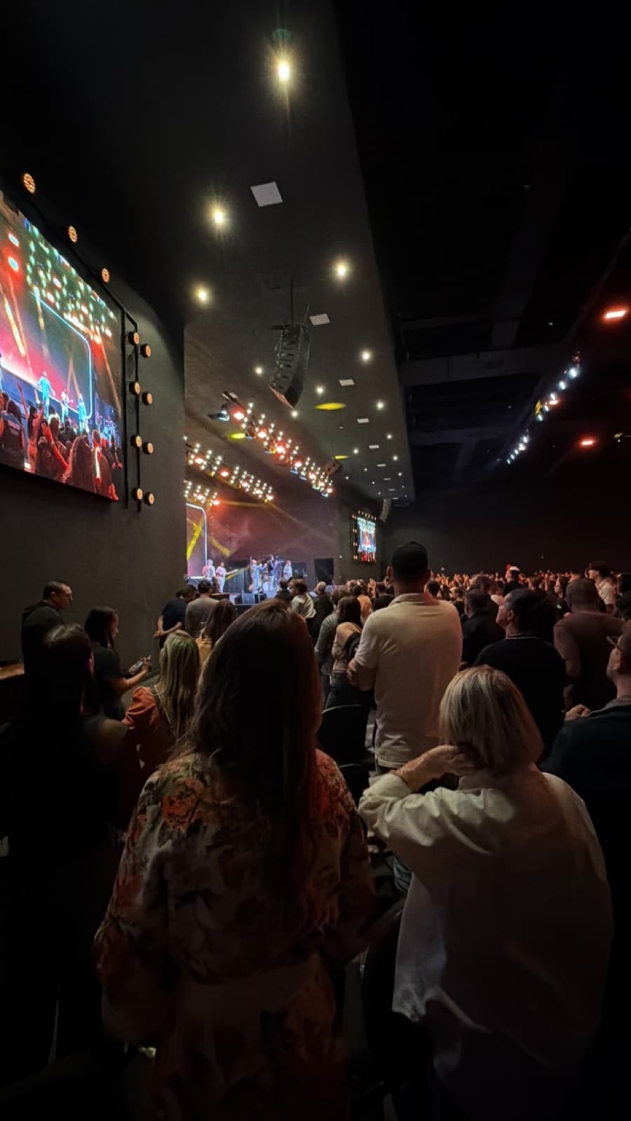 Pedro's church auditorium packed with people during worship