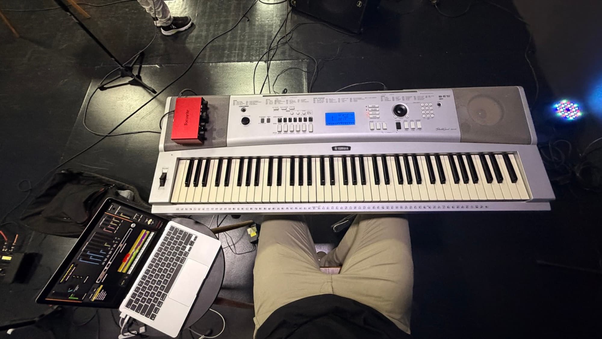 Top-down view of Pedro's stage piano and laptop rig before playing in Florida
